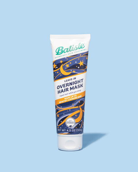 Product photo of Batiste Leave-In Overnight Hair Mask on blue background.