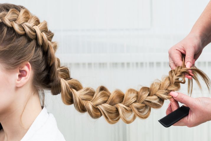  Close up of a braided hairstyle.