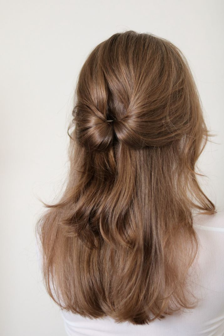 Back view of a half-up half-down hairstyle.